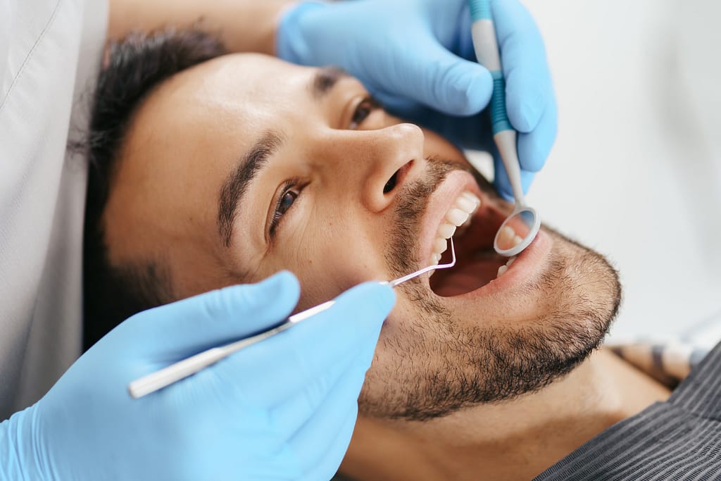 A young man gets a dental checkup